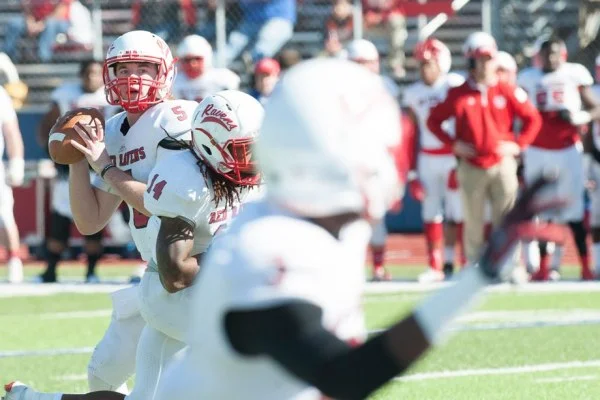 American football quarterback passing